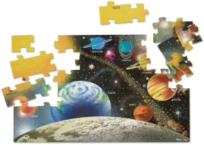  ?? ?? This image released by Melissa & Doug shows a 48-piece puzzle of the solar system. The sturdy, large pieces make this big floor jigsaw puzzle a fun one for the family to assemble. (Melissa & Doug via AP)