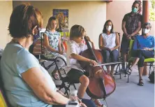  ?? PHOTOS BY LUKE E. MONTAVON/FOR THE NEW MEXICAN ?? Jack Smucker, 9, performs Bach’s Cello Suite No. 1 in G Major at his grandmothe­r June Yoder’s home Thursday for their church group.