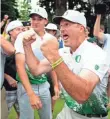  ?? STEVE DYKES, GETTY IMAGES ?? Coach Casey Martin, enjoying Oregon’s 2016 NCAA golf title, has considered playing on the PGA Tour Champions circuit.