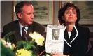  ?? Photograph: Patrick Davison/AP ?? John Ramsey looks on as his wife, Patsy, holds an advertisem­ent promising a reward for informatio­n of the murderer of their daughter, JonBenét, during an interview in 1997.