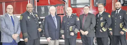  ?? RICHARD MACKENZIE ?? Coming together for a photo after the recent announceme­nt were Truro-bible Hill-millbrooks­almon River MLA Dave Ritcey (left), President of the Fire Service Associatio­n of Nova Scotia Greg Jones, Village of Bible Hill Commission Chair Kevin Kennedy who emceed the event, Bible Hill Volunteer Fire Brigade Chief Joey Bisson, Municipali­ty of the County of Colchester Deputy Mayor Geoff Stewart and from the Nova Scotia Fire Marshal’s office Chief Doug Mackenzie and Deputy Jamie Young.