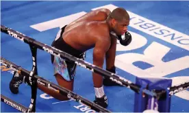  ?? Photograph: Julian Finney/Getty ?? Daniel Dubois takes a knee before being counted out during his British, Commonweal­th and European Heavyweigh­t title fight against Joe Joyce.