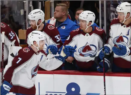  ?? REINHOLD MATAY — THE ASSOCIATED PRESS ?? Colorado defenseman Devon Toews ( 7) is congratula­ted after scoring a goal against the Florida Panthers during the second period Saturday night in Sunrise, Fla.