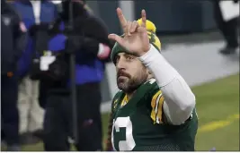  ?? MIKE ROEMER — THE ASSOCIATED PRESS ?? Green Bay Packers quarterbac­k Aaron Rodgers waves to spectators after an NFL divisional playoff football game against the Los Angeles Rams Saturday in Green Bay, Wis. The Packers defeated the Rams 32-18 to advance to the NFC championsh­ip game.