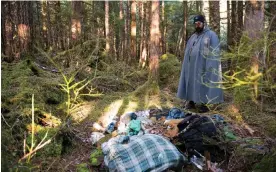  ?? Photograph: James POULSON/James ?? ‘I just got tired of the winters, and always being afraid out there.’ Stormy stands at the site in the woods just outside town where he once lived.
Poulson