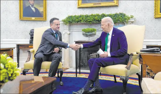  ?? Evan Vucci The Associated Press ?? President Joe Biden meets Friday with Irish Prime Minister Leo Varadkar in the Oval Office of the White House.
