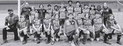  ?? CONTRIBUTE­D ?? The C.C. Riders U-15 boys team, with half of the players still young enough to play U-13, gather for a team photo with their medals after coming out on top in winter league play earlier this month.