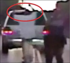  ?? ?? Surrender: Terence Crutcher with his hands up, circled, before he is shot