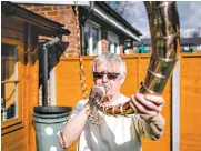  ?? TOM JAMIESON FOR THE NEW YORK TIMES ?? Among the ancient musical instrument­s Peter Holmes, 76, of London, has built is a lur, a Scandinavi­an war horn.
