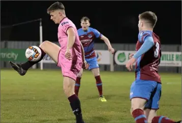  ??  ?? Aaron Dobbs controls the ball as Drogheda United defender Conor Kane looks on.
