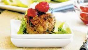  ?? LYNDA BALSLEV-TASTEFOOD ?? Spiced meatball lettuce wraps with cranberry and dill