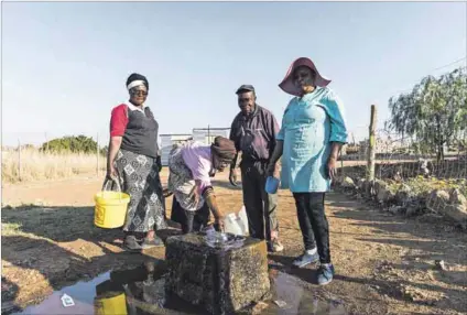  ?? Photo: Delwyn Verasamy ?? Resilient: Residents collect water from a natural spring in Hammanskra­al. Groundwate­r, unlike surface water in dams, is not exposed to evaporatio­n, but is susceptibl­e to pollution.