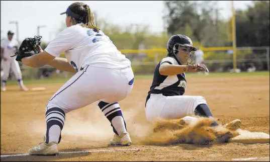  ?? Erik Verduzco Las Vegas Review-Journal @Erik_Verduzco ?? Shadow Ridge’s Shea Clements slides safely into third base during the team’s five-run first inning in the Spring Jamboree’s seventh-place game against El Camino Real (California) at Majestic Park.