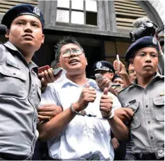  ?? — AFP ?? Wa Lone and his colleague have been held in Yangon’s notorious Insein prison since their arrest in December.