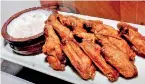  ??  ?? Hot favourite: Hot wings and buffalo curd dip