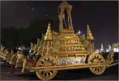  ??  ?? The royal o cials pull to the royal chariot which will be used to carry the body and the royal urn of the late Thai King Bhumibol Adulyadej, before royal funeral past the Grand Palace during the Royal Funeral in Bangkok, Thailand on Thursday. Thailand...