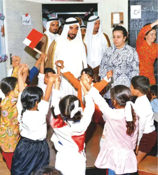  ?? Courtesy: National Archives ?? Right: Shaikh Zayed Bin Sultan Al Nahyan, with His Highness Shaikh Humaid Bin Rashid Al Nuaimi, Member of the Supreme Council and Ruler of Ajman, during the President’s tour of a school in the emirate on April 12, 1972.