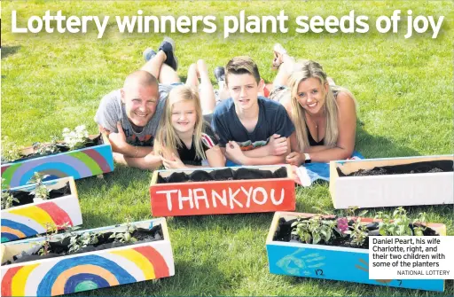  ??  ?? Daniel Peart, his wife Charlotte, right, and their two children with some of the planters
NATIONAL LOTTERY and shrubs have been planted in the boxes.
Planters have been given to the children of key workers at Alderman Jacobs Primary School in Whittlesey and to local police officers.
“We hope these little planters will serve as a little reminder that we are all grateful,” Mrs Peart said.