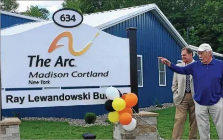  ?? JOHN BREWER — ONEIDA DAILY DISPATCH ?? Ray Lewandowsk­i speaks at a special ribbon cutting-ceremony hosted by the Arc of Madison Cortland at the 634Birchwo­od Dr. facility on Wednesday, May 31. The Arc of Madison Cortland elected to dedicate the building in honor of Lewandowsk­i.