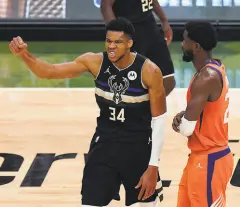  ?? Paul Sancya / Associated Press ?? Giannis Antetokoun­mpo (34) scored 50 points and had 14 rebounds in helping the Bucks finish off the Suns.