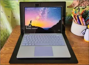  ??  ?? The Surface Laptop Go, nestled into the lap of the 15in Surface Laptop 3.