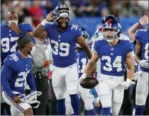  ?? COREY SIPKIN — THE ASSOCIATED PRESS ?? New York Giants running back Sandro Platzgumme­r (34) reacts after a running play in the second half of an NFL preseason football game against the New York Jets, Saturday, Aug. 14, 2021, in East Rutherford, N.J.