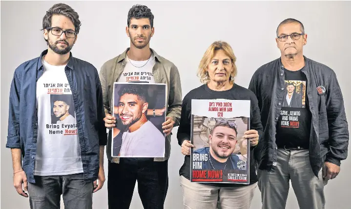  ?? ?? From left, Matan Eshet, Ilay David, Orit Meir, also inset below, and Aviram Meir wear the images of their loved ones on their visit to London