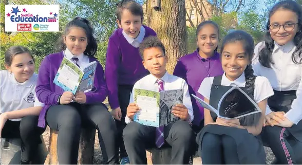  ?? ?? INNOVATION Children at St Albert’s primary school with stories representi­ng them