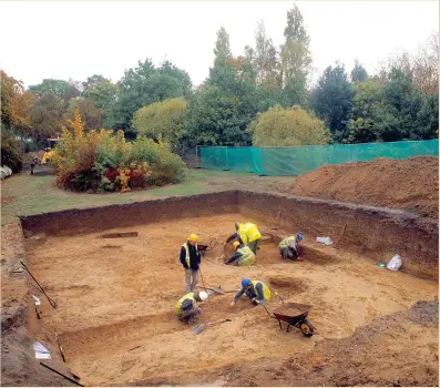  ??  ?? Above: Looking north-east across Trench 1; the burial chamber is beginning to appear centre right, with an Iron Age ditch crossing in the foreground