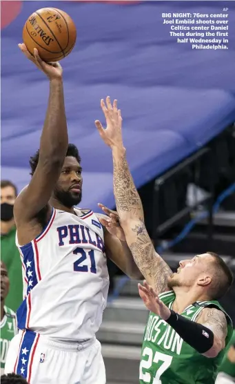  ?? Ap ?? BIG NIGHT: 76ers center Joel Embiid shoots over Celtics center Daniel Theis during the first half Wednesday in Philadelph­ia.