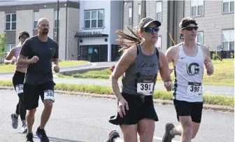  ?? The Sentinel-Record/Tanner Newton ?? Anne Perry (391) and James Helms (395) start the 25th Annual Norma Lampert Memorial Lupus Springers 5K in 2021. The race returns for its 26th running Saturday.