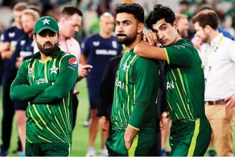  ?? — AFP photo ?? Pakistan’s Muhammad Rizwan (left) and Naseem Shah (right) look on after the ICC men’s Twenty20 World Cup Final against England at Melbourne Cricket Ground (MCG) in Melbourne.