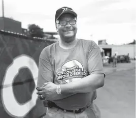  ?? PHOTO BY SARAH PHIPPS, THE OKLAHOMAN ?? Marvin Mack helped a family from California during the severe weather that hit during the Women’s College World Series.