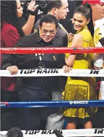  ??  ?? FORMER GOVERNOR of Ilocos Sur and the Deputy National Security Adviser Luis “Chavit” Singson, who is one of the backers for the holding of the Miss Universe pageant in the Philippine­s this year, and Miss Universe 2015 Pia Alonzo Wurtzbach, stand next to the boxing ring before Manny Pacquiao’s WBO welterweig­ht championsh­ip fight against Jessie Vargas on Nov. 5, 2016 in Las Vegas, Nevada.