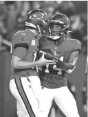  ?? AP ?? Bucs receiver Chris Godwin celebrates with Tom Brady after a 13-yard TD reception during the first quarter.