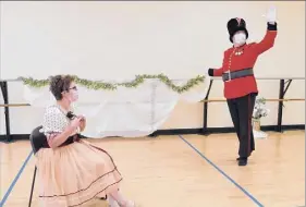  ?? Anthony Tassarotti ?? Laura Casellini as Clara, seated, and Eric Meichtry as the Nutcracker.