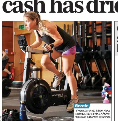  ??  ?? BACK IN THE SADDLE: A gym user in South-West London yesterday as sites reopened for the first time since lockdown