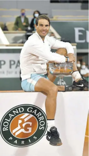  ??  ?? Spain’s Rafael Nadal poses with the Mousquetai­res Cup (The Musketeers) during the podium ceremony after winning the men’s singles final tennis match against Serbia’s Novak Djokovic, at Philippe Chatrier court on day 15 of The Roland Garros 2020 French Open tennis tournament in Paris, yesterday.