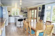  ??  ?? The open-plan kitchen/dining/living area is heated by a logburner.