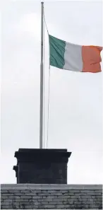 ??  ?? A flag flies at half mast at Leinster House, the parliament in Dublin.