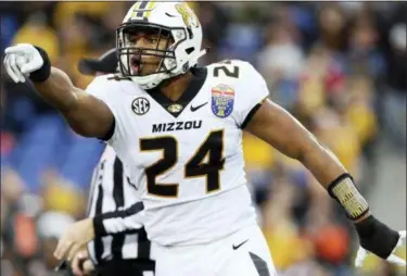  ?? JOE RONDONE — THE ASSOCIATED PRESSS ?? Missouri linebacker Terez Hall celebrates a tackle against Oklahoma State during the first half of the Liberty Bowl.