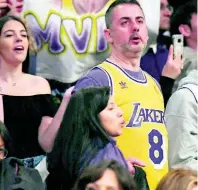  ?? AP ?? A fan stands while wearing a Kobe Bryant jersey during the second half of an NBA basketball game between the Los Angeles Lakers and the San Antonio Spurs on Tuesday night in Los Angeles. The Lakers won 129-102.