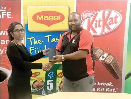  ?? Photo: Swashna Chand ?? From left: Merewalesi Williams of Delainaves­i, Lami, receiving her Samsung S9 mobile phone from Nestle sales operations manager Sanjeet Singh at Wailekutu on August 3, 2018.