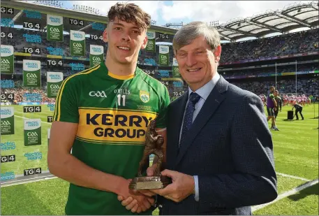  ??  ?? Pat O’Doherty, Chief Executive, ESB, sponsor of the All-Ireland Minor Championsh­ips, presenting David Clifford with the Player of the Match award for his outstandin­g performanc­e in the Electric Ireland GAA Football All-Ireland Minor Championsh­ip Final...