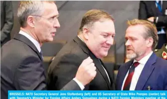  ?? — AFP ?? BRUSSELS: NATO Secretary General Jens Stoltenber­g (left) and US Secretary of State Mike Pompeo (center) talk with Denmark’s Minister for Foreign Affairs Anders Samuelsen during a NATO Foreign Ministers meeting at the NATO headquarte­rs in Brussels yesterday.
