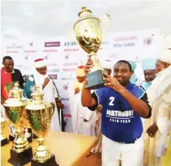  ??  ?? Captain of Northbury team from Port Harcourt, Abubakar Kolere lifts the Emir of Argungu Cup to the admiration of the crowd during the closing ceremony of the just concluded NSK Polo Tournament in Kebbi State last weekend.