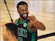  ?? Kevin C. Cox / Getty Images ?? Boston Celtics point guard Kemba Walker said Wednesday that his left knee has responded well to a stem cell injection that is expected to keep him out until at least January.