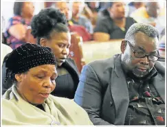  ??  ?? TRYING TIME: Constable Caroline Mjandana’s mother, Nompumelel­o Mjandana, left, and her father, Menzi, at yesterday’s memorial service