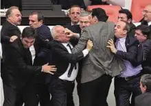  ?? Reuters ?? Tempers boil over Lawmakers from the opposition Republican People’s Party and ruling AK Party scuffle during a debate in Parliament in Ankara on February 19.