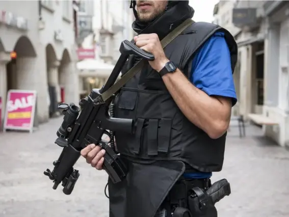  ??  ?? Armed police in the old town of Schaffhaus­en, near the German border (EPA)